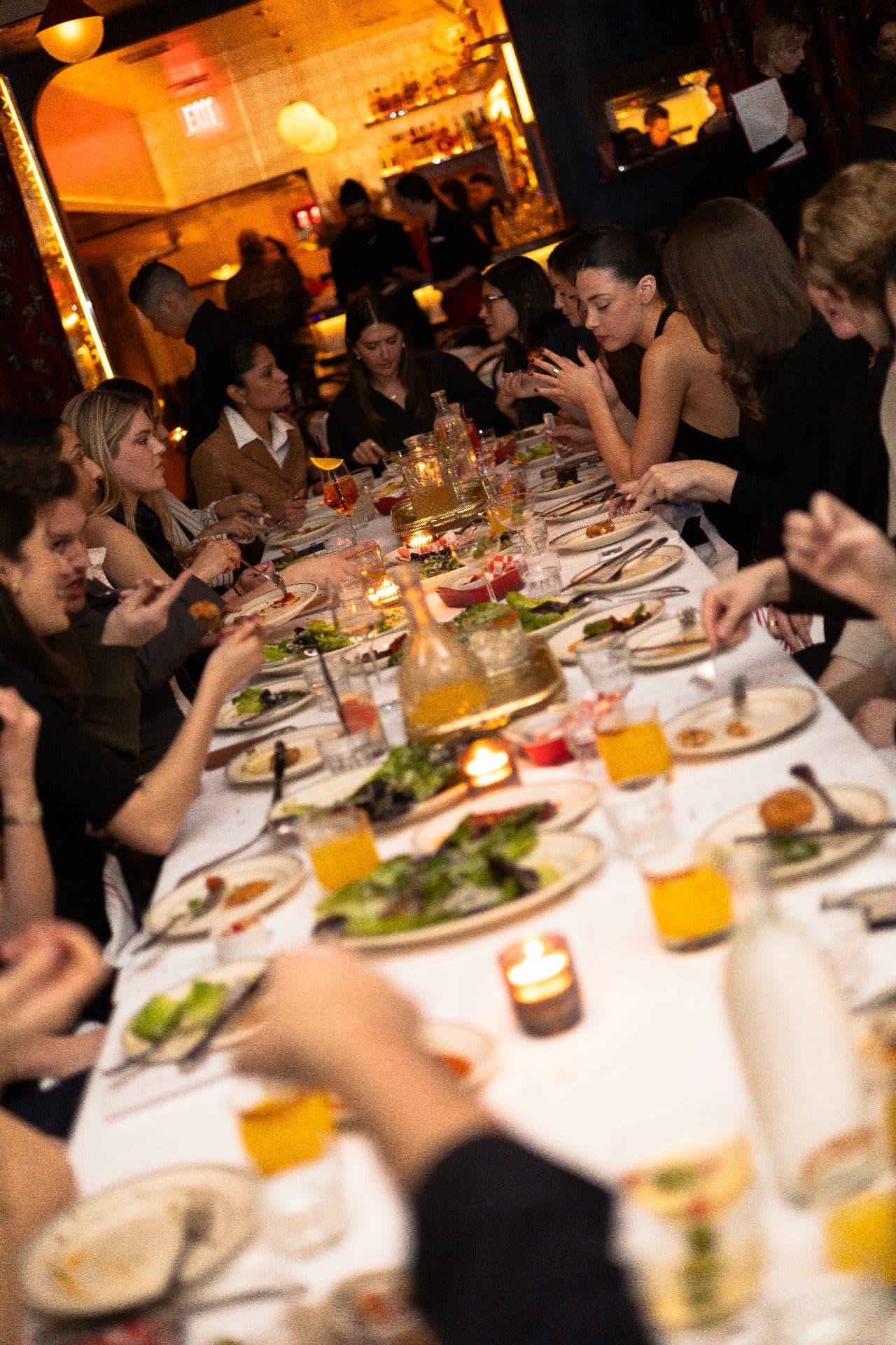 Brand partners gathered around a dinner table at Jean's on Lafayette